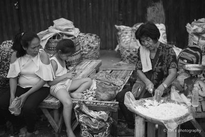 Group of people sitting outdoors