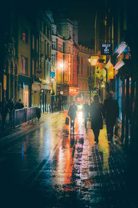 View of illuminated street lights at night