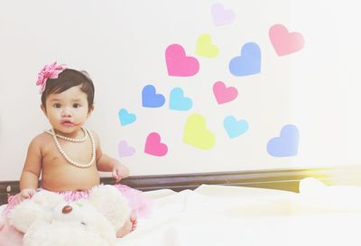 Portrait of cute girl with balloons