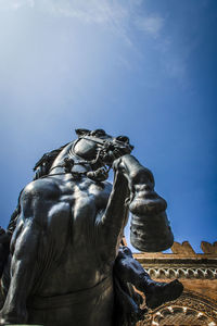 Low angle view of statue against sky