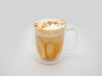 Close-up of coffee cup against white background
