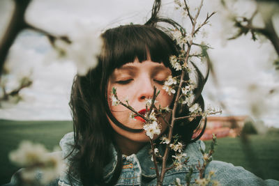 Close-up portrait of a young woman outdoors