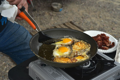 Close-up of man preparing food in kitchen