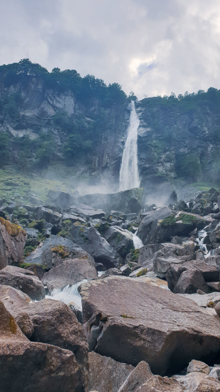 rock, scenics - nature, water, solid, beauty in nature, rock - object, motion, geology, power in nature, long exposure, power, nature, waterfall, day, environment, physical geography, sky, rock formation, no people, flowing water, outdoors, hot spring, flowing