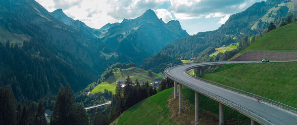 High angle view of road amidst mountains against sky