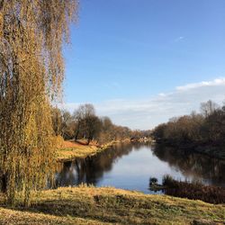 Scenic view of lake against sky during autumn