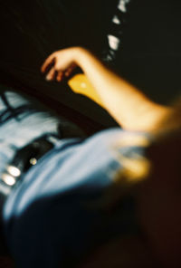 Midsection of woman sitting on floor