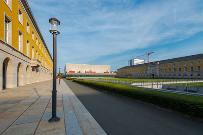 Street amidst buildings against sky