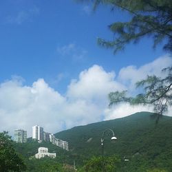 Scenic view of mountains against cloudy sky