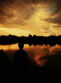 Scenic view of lake at sunset