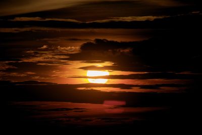 Scenic view of sea against romantic sky at sunset