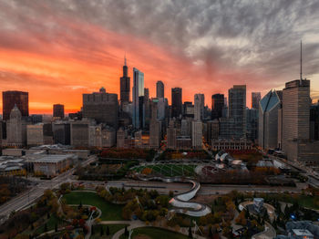 Chicago millennium park with skyscrapers in background at sunset aerial