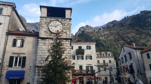 Low angle view of clock tower against sky