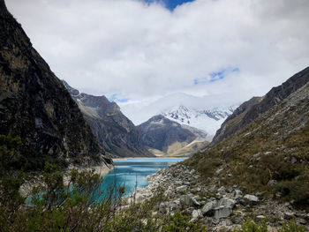 Scenic view of lake and mountains against sky