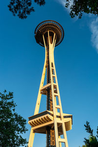 Low angle view of water tower against blue sky