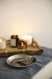 Close-up of tea light candles on table