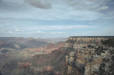 High angle view of buildings against cloudy sky