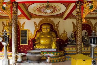 Buddha statue in temple outside building