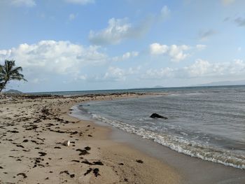 Scenic view of beach against sky