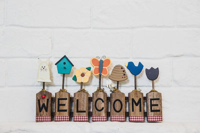 Welcome text hanging on white wall