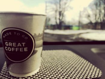 Close-up of coffee cup on table