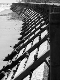 High angle view of wooden logs on beach