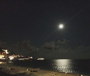 Scenic view of sea against sky at night