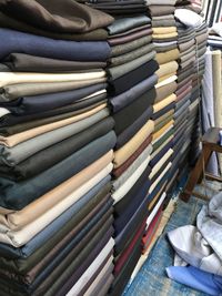 High angle view of fabrics stacked in store for sale