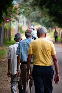 A group of elderly friends going for an evening walk