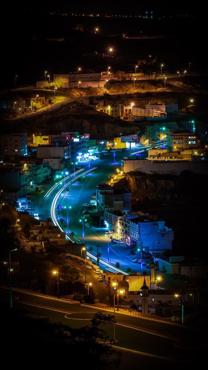 HIGH ANGLE VIEW OF ILLUMINATED CITYSCAPE