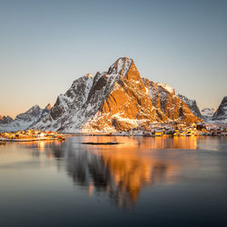 Scenic view of snowcapped mountains against clear sky during winter