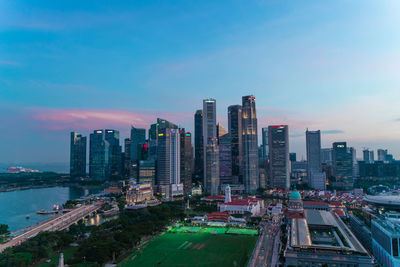 Illuminated cityscape against sky with old and ancient buildings