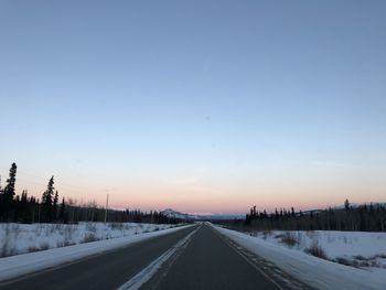 Road against sky during winter