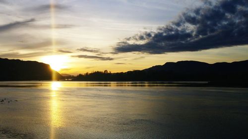 Scenic view of sunset over lake