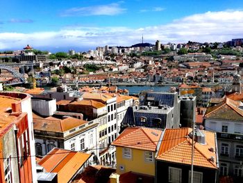 High angle view of houses in town against sky