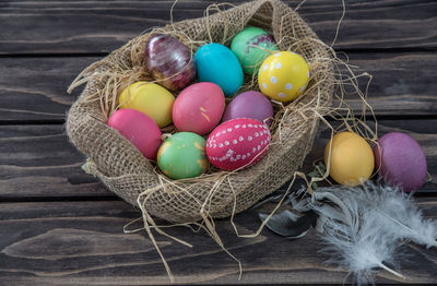 High angle view of easter eggs in jute sack on table