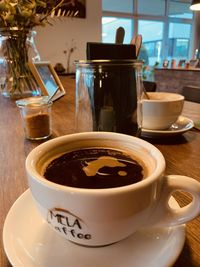 Close-up of coffee cup on table