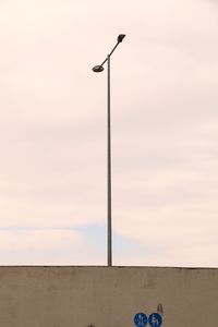 Low angle view of street light against sky