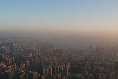 High angle view of buildings in city against clear sky