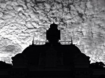 Low angle view of church against cloudy sky