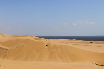 Scenic view of desert against sky