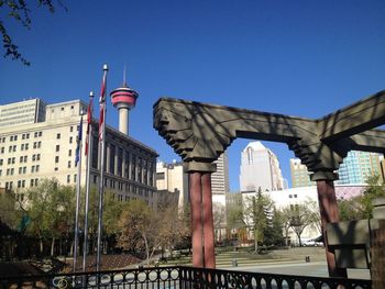 Low angle view of buildings against clear blue sky