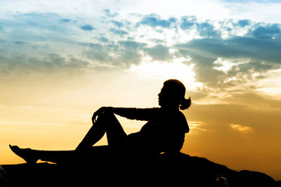 Silhouette of people at sunset