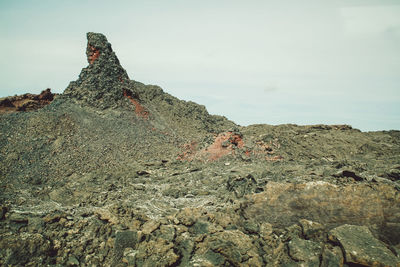 Rock formations on landscape against sky