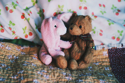 Close-up of stuffed toys on bed