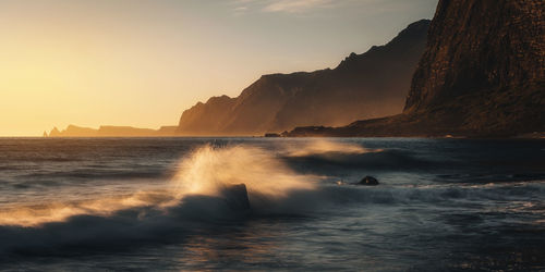 Scenic view of sea against sky during sunset