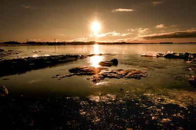 Scenic view of sea against sky during sunset