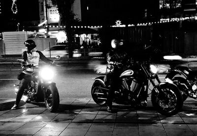 Bicycles parked on road at night