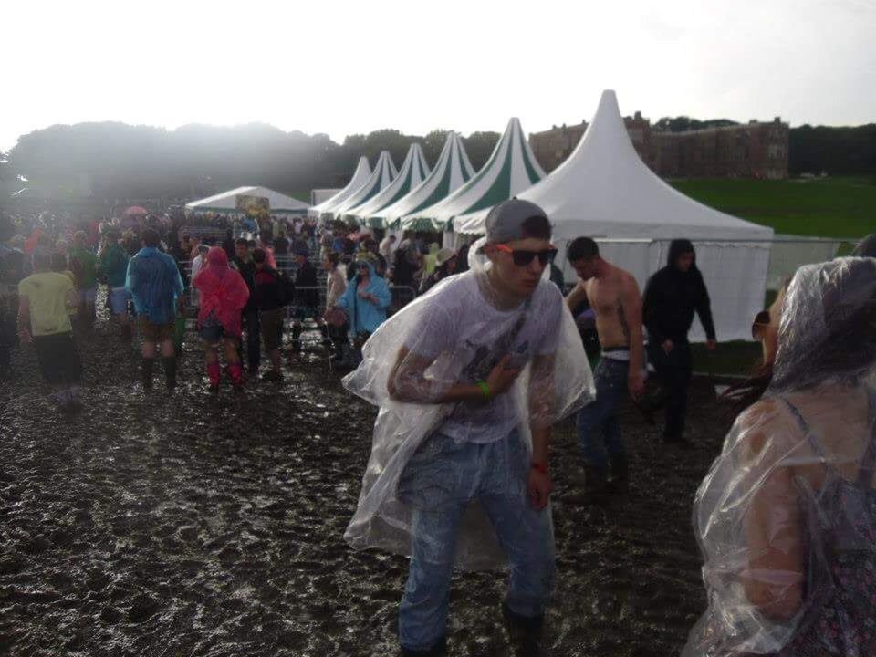 PEOPLE STANDING ON TOP OF HILL