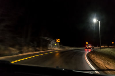 Car on road at night